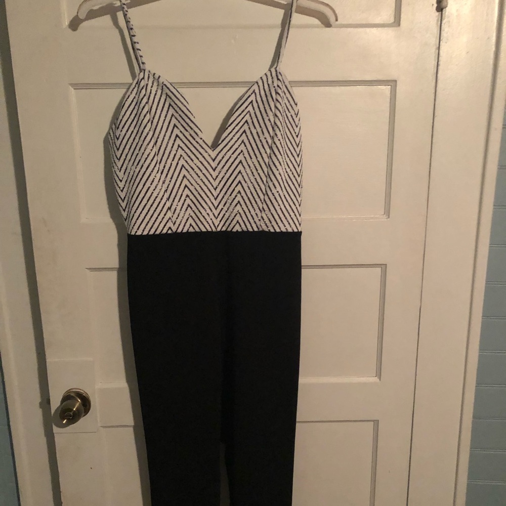 Sexy low cut one piece pants suit.